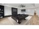 Spacious basement with a pool table, entertainment area, and modern finishes, perfect for recreation at 1255 E M Croy Rd, Sugar Hill, GA 30518