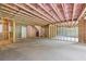Unfinished basement with exposed framing at 1255 E M Croy Rd, Sugar Hill, GA 30518