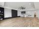 Finished basement featuring a sleek wet bar, integrated entertainment area, and modern recessed lighting at 1255 E M Croy Rd, Sugar Hill, GA 30518