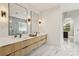 Luxurious bathroom with double vanity, soaking tub, and marble flooring at 1255 E M Croy Rd, Sugar Hill, GA 30518