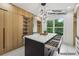 Custom walk-in closet with built-in storage solutions and premium cabinetry details at 1255 E M Croy Rd, Sugar Hill, GA 30518
