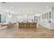 Gourmet kitchen with large island, modern lighting, seating and views of the breakfast area at 1255 E M Croy Rd, Sugar Hill, GA 30518