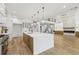 Gourmet kitchen with oversized island and views to the living room with fireplace at 1255 E M Croy Rd, Sugar Hill, GA 30518