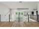 Upper loft area showcasing an upgraded glass railing overlooking the main level and natural light at 1255 E M Croy Rd, Sugar Hill, GA 30518