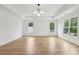 A bright primary bedroom with tray ceiling and large windows with great natural light at 1255 E M Croy Rd, Sugar Hill, GA 30518