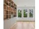 Home office with custom built-in shelving and storage, complemented by bright, natural light at 1255 E M Croy Rd, Sugar Hill, GA 30518