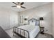 Cozy bedroom with patterned wallpaper, carpet flooring, and modern decor at 1370 Dupont Nw Park, Atlanta, GA 30318