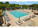 Community pool featuring an expansive deck with lounge chairs, umbrellas, a covered pergola, and a relaxing hot tub at 1370 Dupont Nw Park, Atlanta, GA 30318