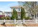 Charming two-story home featuring a white picket fence and well-manicured landscaping at 1370 Dupont Nw Park, Atlanta, GA 30318