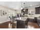 Modern kitchen with granite countertops, stainless steel appliances, an island with seating, and a dining area at 1370 Dupont Nw Park, Atlanta, GA 30318