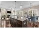 Kitchen with an island, granite countertops, stainless appliances, and is open to the living and dining spaces at 1370 Dupont Nw Park, Atlanta, GA 30318