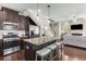 Open-concept kitchen with granite counters, stainless appliances, and a view to the living area at 1370 Dupont Nw Park, Atlanta, GA 30318