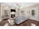 Cozy living room with hardwood floors, fireplace, built-ins, and a comfortable sofa at 1370 Dupont Nw Park, Atlanta, GA 30318
