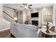 Comfortable living room with a fireplace, hardwood floors and stairs leading up to the second floor at 1370 Dupont Nw Park, Atlanta, GA 30318