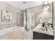 Relaxing main bathroom with separate tub and shower, dual sinks, and modern fixtures at 1370 Dupont Nw Park, Atlanta, GA 30318