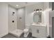 Bathroom featuring modern shower and vanity with black hardware and lighting at 4281 Sierra Creek Ct, Hoschton, GA 30548
