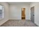 Bright bedroom with carpeted floor, white walls, and access to an en-suite bathroom with tile shower at 4281 Sierra Creek Ct, Hoschton, GA 30548