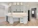 Butler's pantry with custom cabinets, wine refrigerator, and marble backsplash at 4281 Sierra Creek Ct, Hoschton, GA 30548
