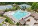 Aerial view of the community pool featuring a slide, splash pad, and lounge chairs for residents at 4281 Sierra Creek Ct, Hoschton, GA 30548