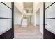 Spacious foyer boasts an open layout, a staircase, and elegant hardwood floors, creating a welcoming entrance at 4281 Sierra Creek Ct, Hoschton, GA 30548