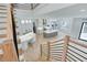 View of the open-concept main floor with kitchen, staircase, and desk area at 4281 Sierra Creek Ct, Hoschton, GA 30548