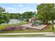View of the community playground that features a slide, swings, and picnic tables at 4281 Sierra Creek Ct, Hoschton, GA 30548