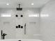 The spacious shower features a rainfall shower head and marbled walls at 4281 Sierra Creek Ct, Hoschton, GA 30548