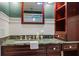 Classic bathroom featuring granite counters, wooden cabinet, and modern sink at 706 Barrington Hills Dr, Atlanta, GA 30350
