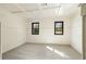 Sunlit bedroom with paneled walls, neutral carpet, and natural light at 706 Barrington Hills Dr, Atlanta, GA 30350