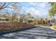 Street view of the community with landscaping, mature trees and multiple buildings at 706 Barrington Hills Dr, Atlanta, GA 30350