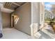 Exterior corner elevation features a covered entryway and concrete walkway at 706 Barrington Hills Dr, Atlanta, GA 30350