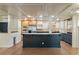 Expansive kitchen with a central island, stainless steel appliances, and contrasting cabinetry, perfect for entertaining at 706 Barrington Hills Dr, Atlanta, GA 30350