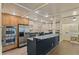 Spacious kitchen with stainless steel appliances, including double ovens, complements stylish cabinets and fixtures at 706 Barrington Hills Dr, Atlanta, GA 30350