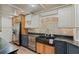 Well-appointed kitchen showcasing stainless steel appliances, granite countertops, and a stylish tile backsplash at 706 Barrington Hills Dr, Atlanta, GA 30350