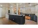 Charming kitchen boasts a black island, modern appliances, and stylish finishes for a culinary haven at 706 Barrington Hills Dr, Atlanta, GA 30350