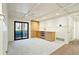Bright living room with built-in cabinets, and a sliding door to the outside at 706 Barrington Hills Dr, Atlanta, GA 30350