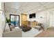 Bright living room with stylish decor, built-in cabinets, and a sliding door to the outside at 706 Barrington Hills Dr, Atlanta, GA 30350