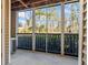 Enjoy picturesque views from this screened patio with privacy provided by trees at 706 Barrington Hills Dr, Atlanta, GA 30350