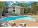 Community pool with lounge chairs and tables on sunny day at 706 Barrington Hills Dr, Atlanta, GA 30350