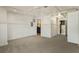 Carpeted room with crisp white walls, and access to the bathroom and kitchen at 706 Barrington Hills Dr, Atlanta, GA 30350