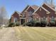Beautiful brick home featuring a manicured lawn and a classic architectural design at 2105 Ector Nw Cv, Kennesaw, GA 30152