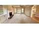 Living room view showcasing a fireplace, built-in bookshelves, and patio access at 2105 Ector Nw Cv, Kennesaw, GA 30152