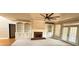 Open living area with built-in shelving, fireplace, and a view of the backyard at 2105 Ector Nw Cv, Kennesaw, GA 30152