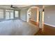 Bright living room featuring hardwood floors and a ceiling fan at 2105 Ector Nw Cv, Kennesaw, GA 30152