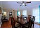 Formal dining room with hardwood floors, ample seating, and access to multiple living areas at 5235 Pounds S Dr, Stone Mountain, GA 30087