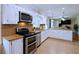 Modern kitchen featuring granite countertops, stainless steel appliances, and ample cabinet space at 5235 Pounds S Dr, Stone Mountain, GA 30087