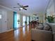 Spacious living area featuring hardwood flooring, large windows, and great natural light at 5235 Pounds S Dr, Stone Mountain, GA 30087