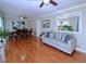 Bright living room featuring gleaming hardwood floors, neutral paint, and modern furnishings at 5235 Pounds S Dr, Stone Mountain, GA 30087