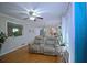 Inviting living room with hardwood floors, comfortable seating, and views into kitchen at 5235 Pounds S Dr, Stone Mountain, GA 30087