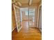 Spacious room featuring French doors, hardwood floors, and ample natural light at 5235 Pounds S Dr, Stone Mountain, GA 30087